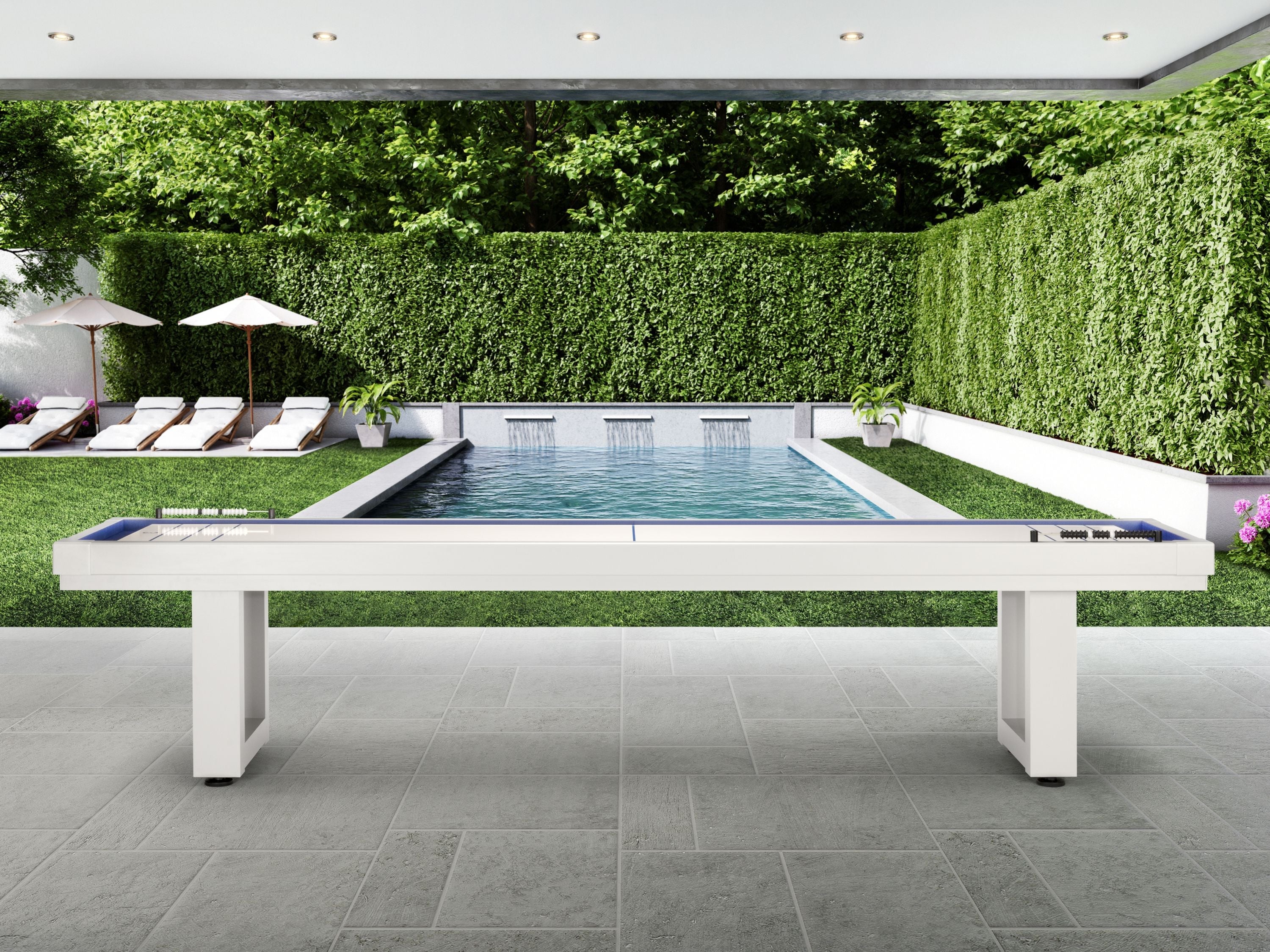 American Heritage Lanai 12' Pearl White Shuffleboard Table on a patio by the pool and garden.