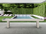 An American Heritage Lanai 12' Outdoor Shuffleboard Table in Oyster Grey sits by the pool.