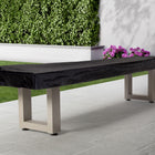 American Heritage Lanai 12' Outdoor Shuffleboard Table in Oyster Grey on patio near garden.