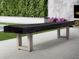 American Heritage Lanai 12' Outdoor Shuffleboard Table in Oyster Grey on patio near garden.