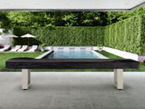 Modern pool area with lounge chairs and an American Heritage Lanai 12' Shuffleboard Table.