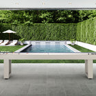 American Heritage Lanai 9' Outdoor Shuffleboard Table in Oyster Grey on a patio with poolside views.