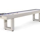 American Heritage Lanai 12' Outdoor Shuffleboard Table in Oyster Grey with pucks and score counters.