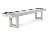American Heritage Lanai 12' Outdoor Shuffleboard Table in Oyster Grey with pucks and score counters.