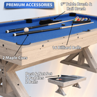 Pool table with accessories including cues, balls, and a paddle set on a white background.