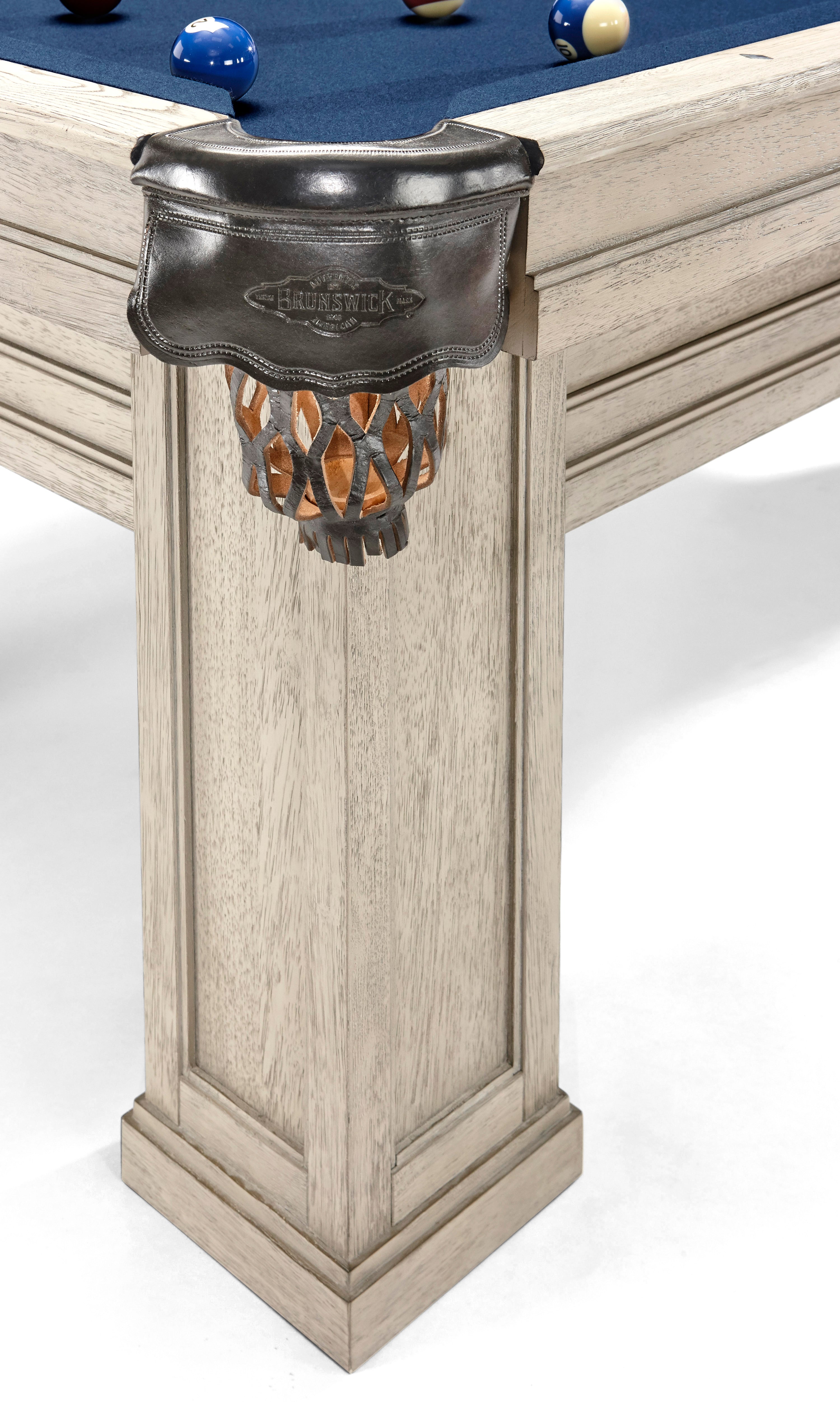 Close-up of Brunswick Billiards OAKLAND II 8' Pool Table corner pocket with blue felt and balls.