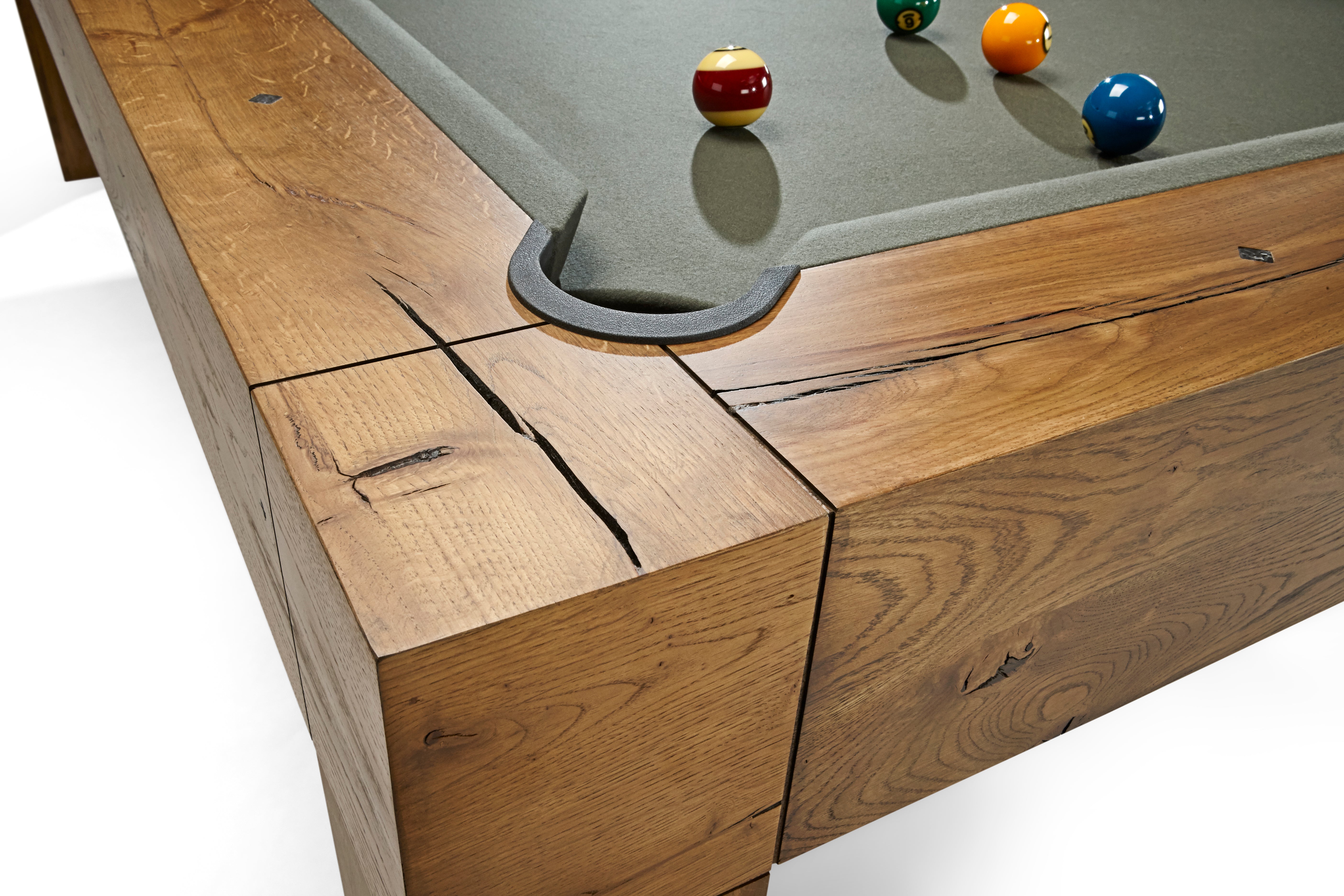 Close-up of Brunswick Billiards Parsons 8' Pool Table corner with balls near the pocket.