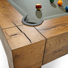 Close-up of Brunswick Billiards Parsons 8' Pool Table corner with balls near the pocket.