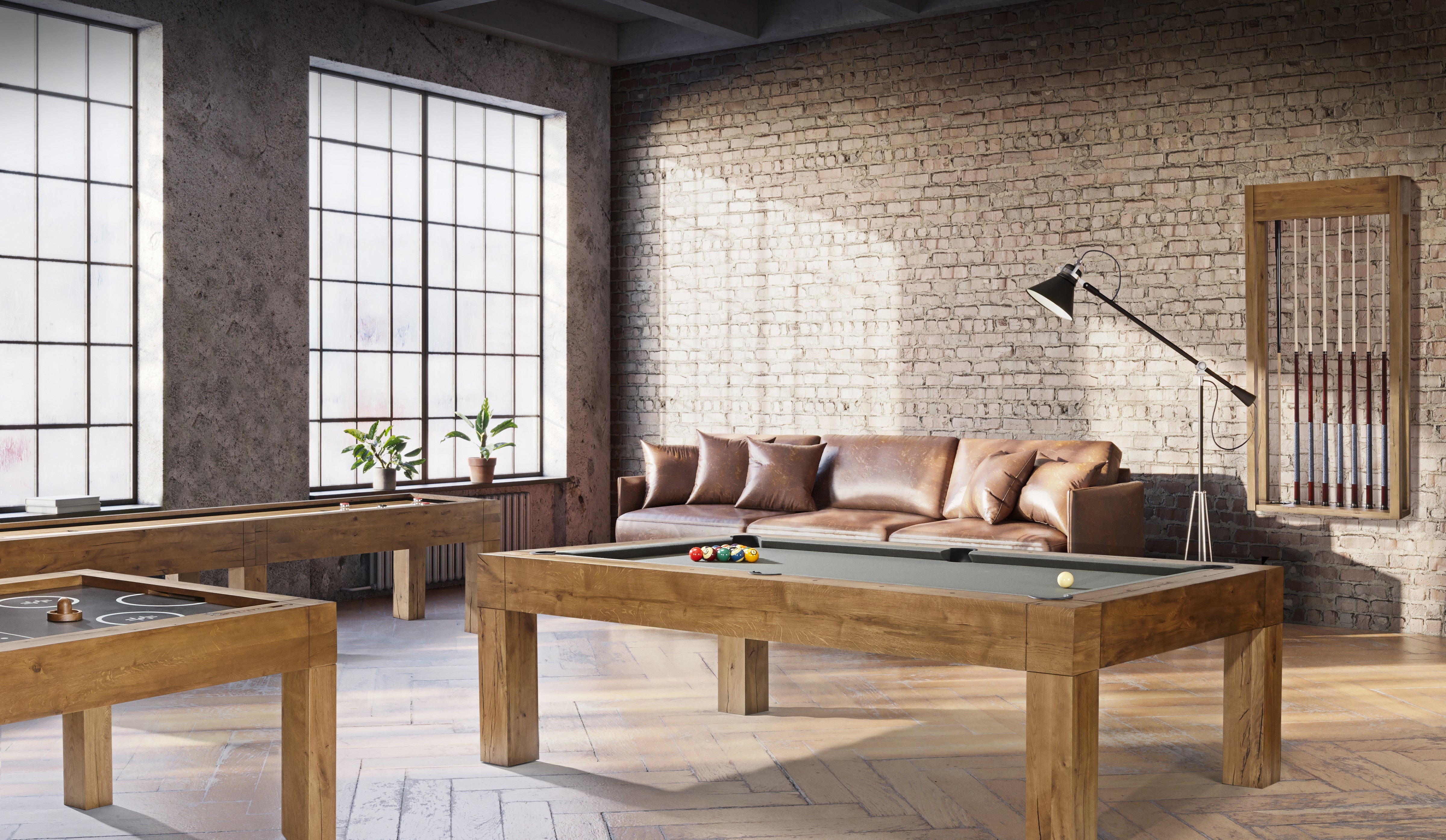 A game room with a Brunswick Billiards Parsons 8' Pool Table, air hockey, sofa, and large windows.