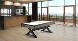 A modern kitchen and living area with a Brunswick Billiards Premier Air Hockey Table and city views.