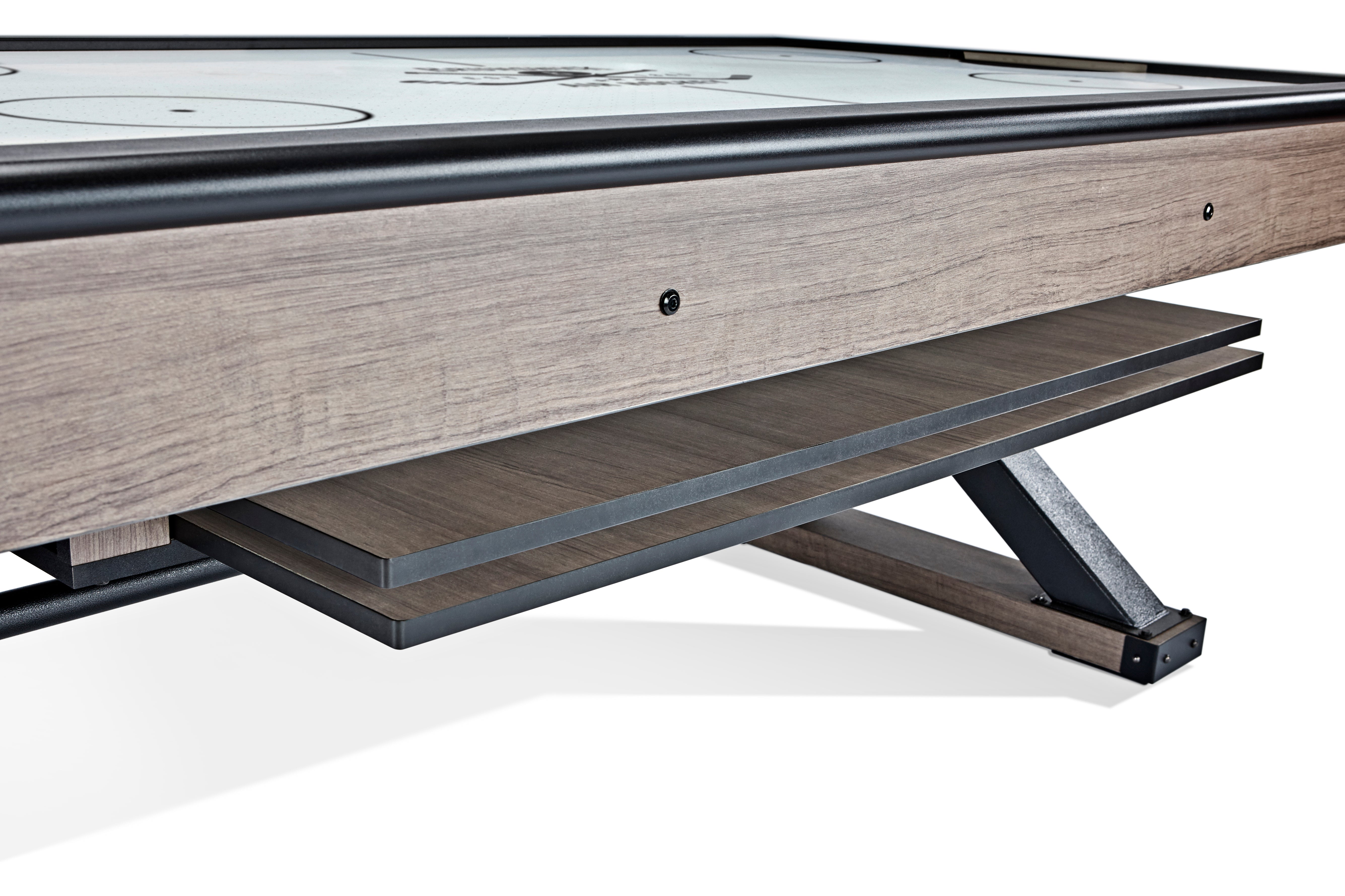 Close-up of Brunswick Billiards Premier Air Hockey Table with storage shelf under the surface.