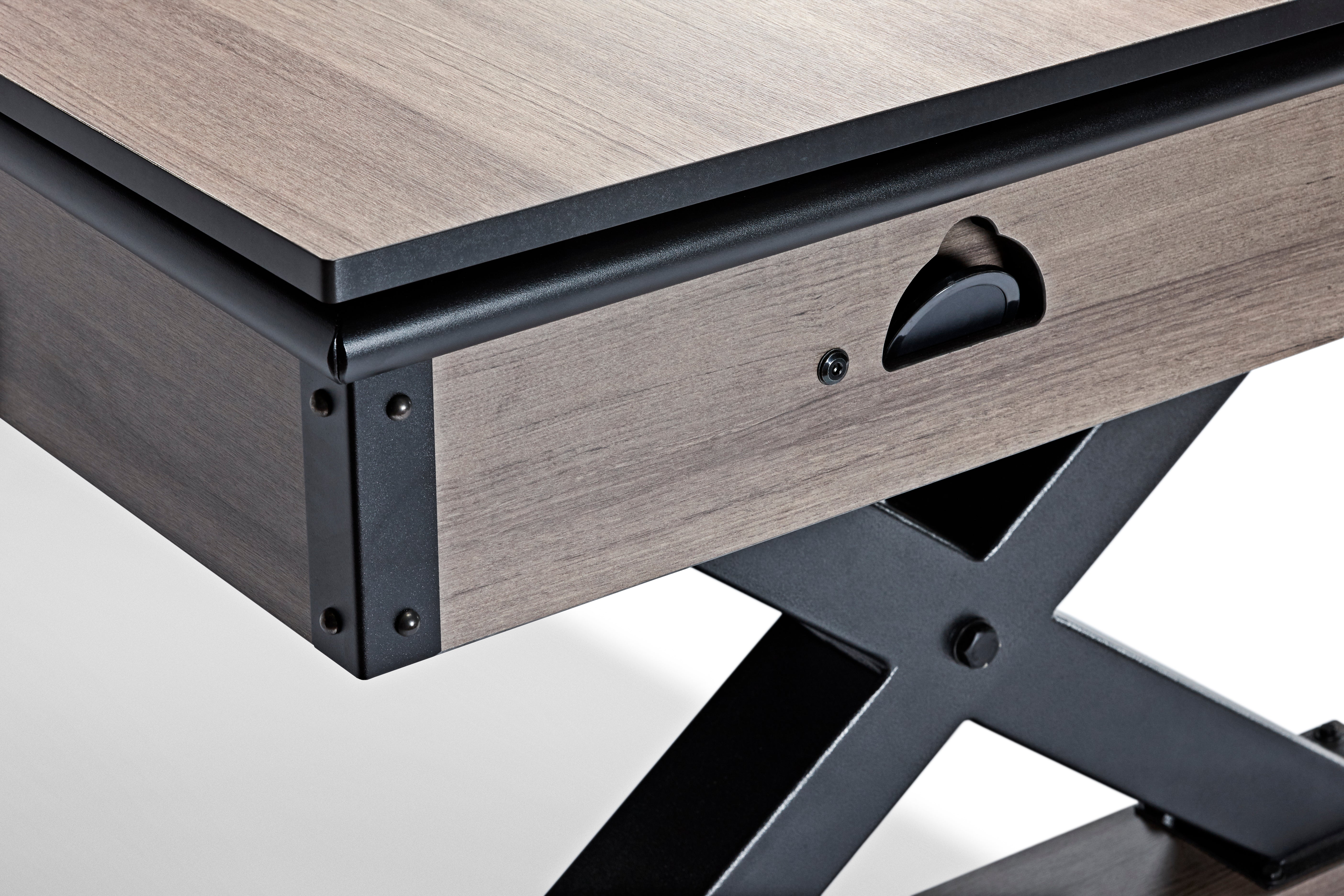 Close-up of the Brunswick Billiards Premier Air Hockey Table with black metal legs and drawer handle.