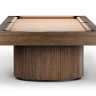 A modern pool table with a fluted cylindrical wooden base and a light tan felt playing surface, shown from a top-down perspective on a white background.