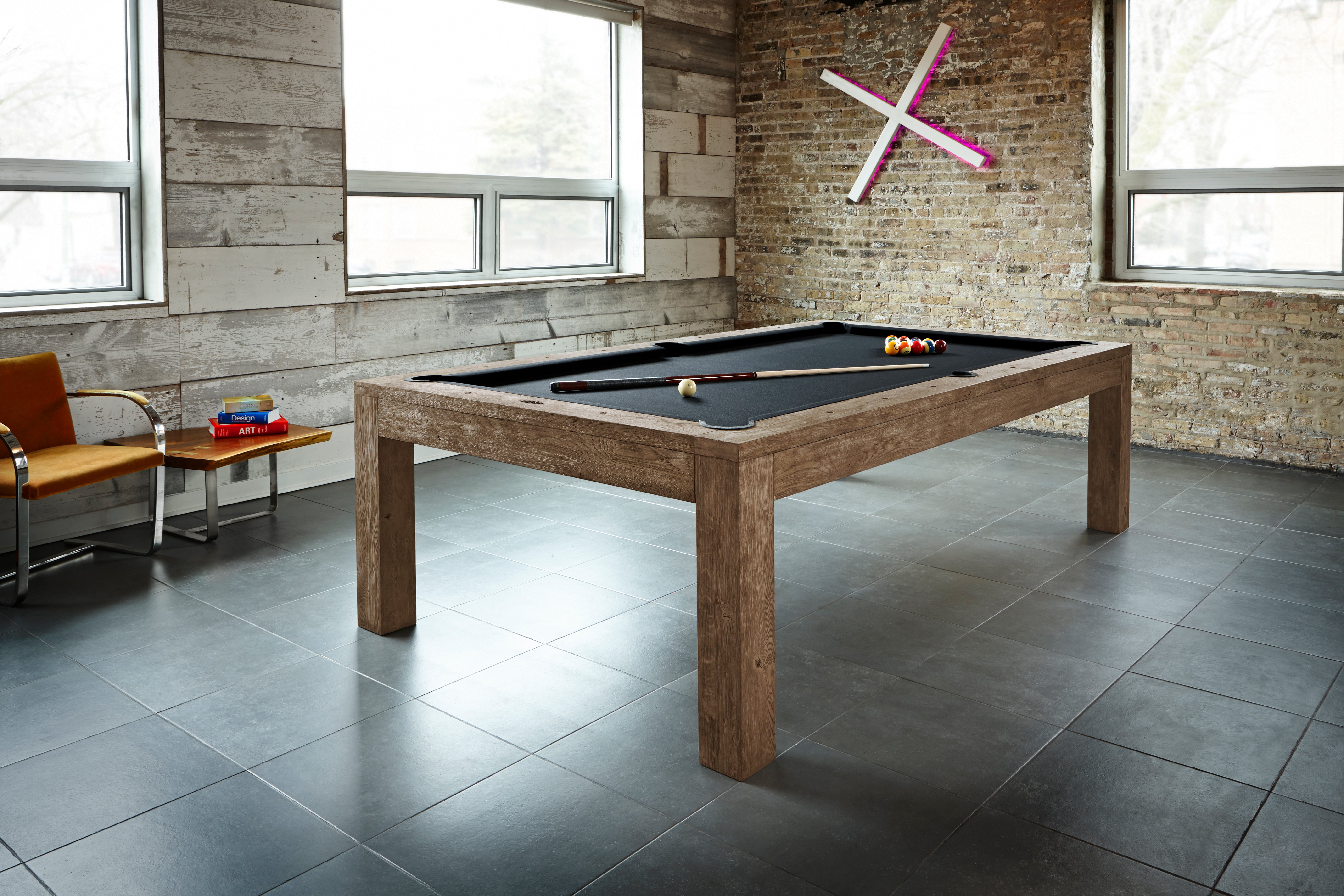 The Brunswick Billiards Sanibel 7' Slate Pool Table in Rustic Dark Brown anchors the sunlit room.
