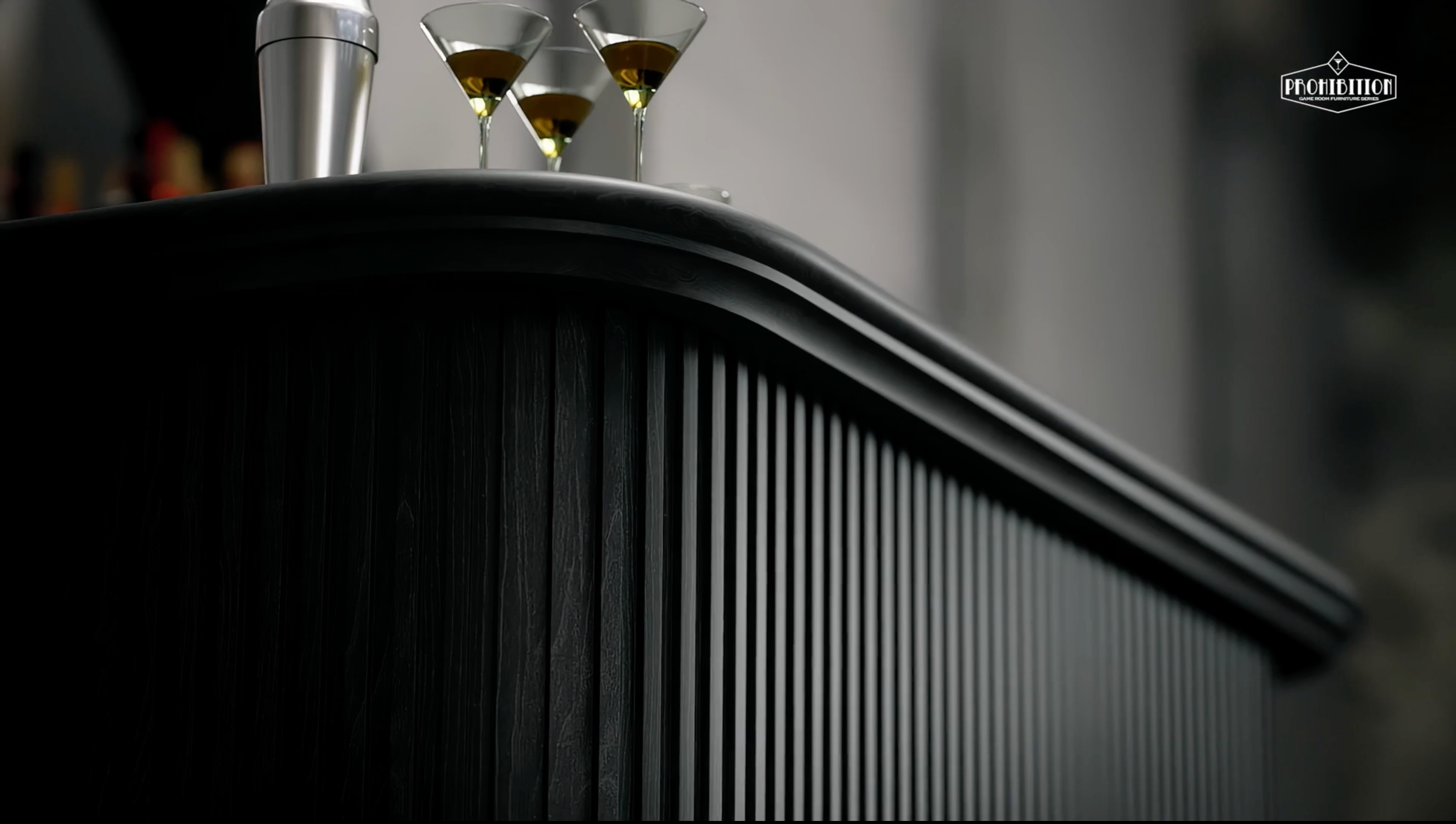 Three martini glasses and shaker on RAM Game Room Prohibition 84" Cocktail Bar - Black.