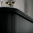 Three martini glasses and shaker on RAM Game Room Prohibition 84" Cocktail Bar - Black.