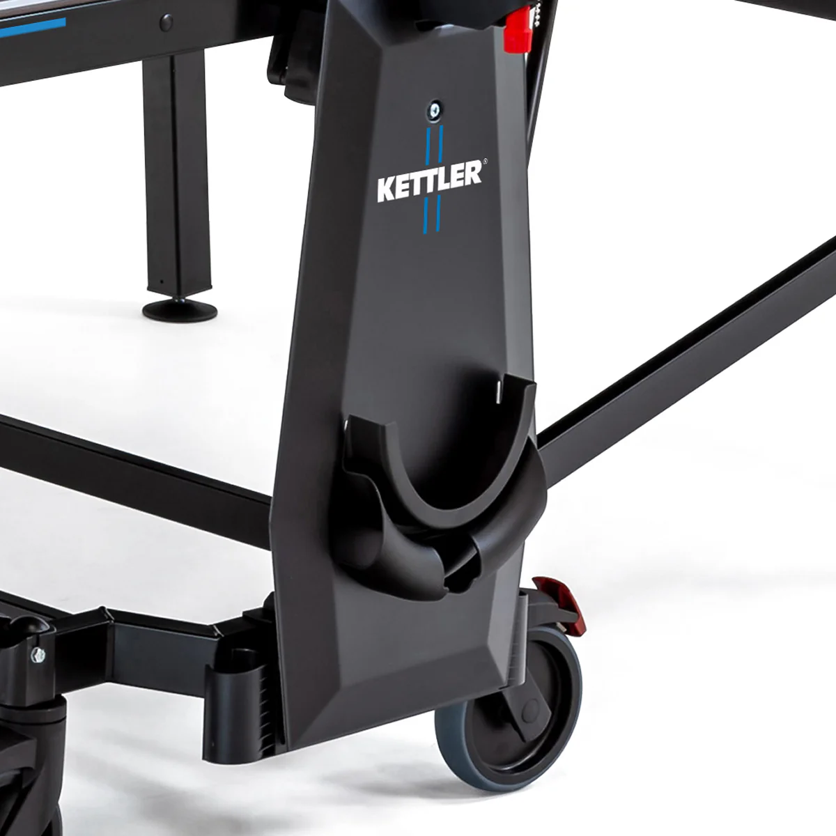 Close-up of Kettler Sedona Outdoor Table Tennis Table leg with wheels and paddle holder.
