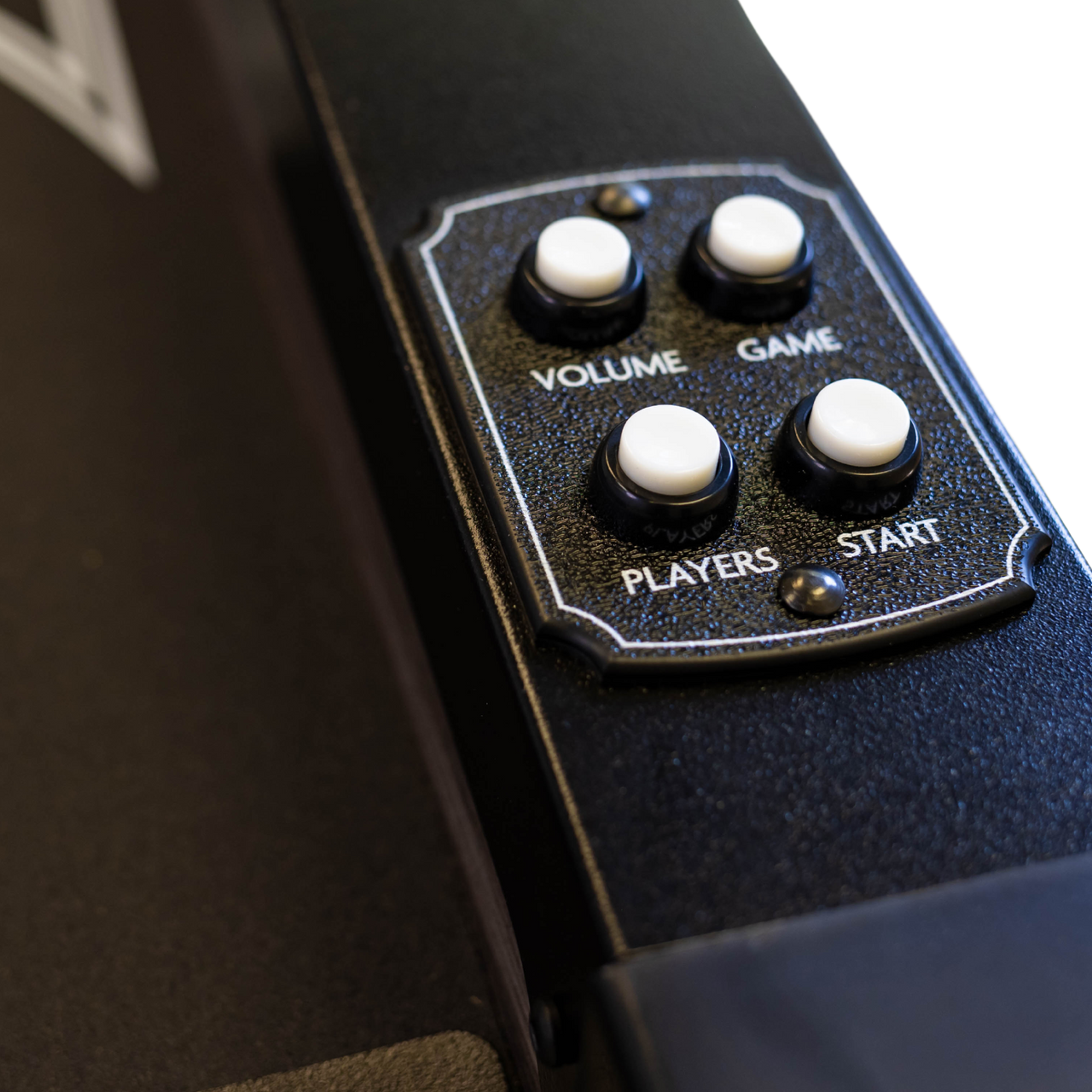 Control panel with buttons labeled 'Volume', 'Game', 'Players', and 'Start' on a black surface.
