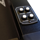 Control panel with buttons labeled 'Volume', 'Game', 'Players', and 'Start' on a black surface.