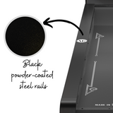Black powder-coasted steel rails on skee ball machine.