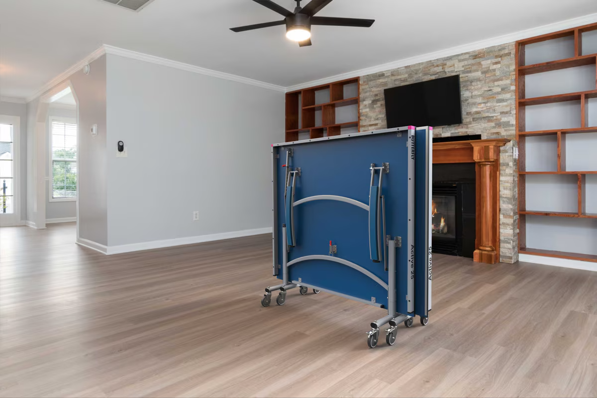 Blue folding table on wheels in a living room setting