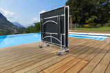 Portable sunshade on a wooden deck by a pool with scenic background