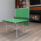 A vibrant Butterfly Junior Rollaway Table Tennis Table in green indoor in room