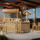 RAM Game Room 60" Bamboo Tiki Bar with barstools creates a cozy lounge for your pergola.