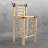 Set of two bamboo Tiki bar stools by RAM Game Room, shown against a concrete wall.