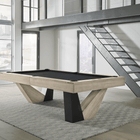 American Heritage Billiards Annex 8' table in a modern game room with metal stairs and large windows.