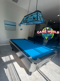Modern pool table with blue felt in a room with a 'Game World Planet' sign.