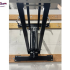 Black metal stand on a wooden platform with 'First Team' branding.