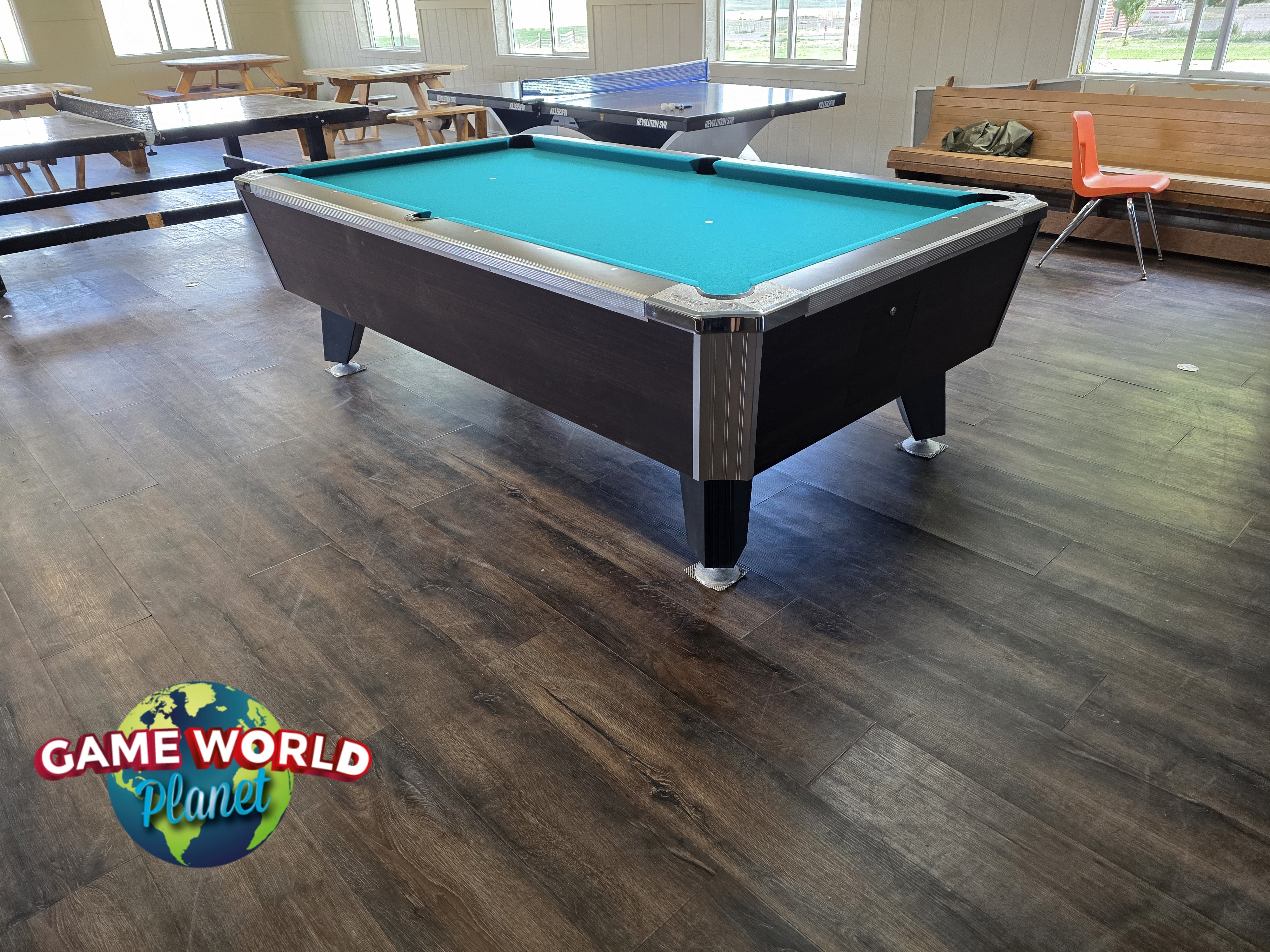 A Valley Panther Dakar Ebony Pool Table in a game room with ping pong and seating behind.