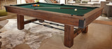 The Brunswick Billiards Canton 7' Pool Table in Black Forest on a tiled floor with balls and cues.