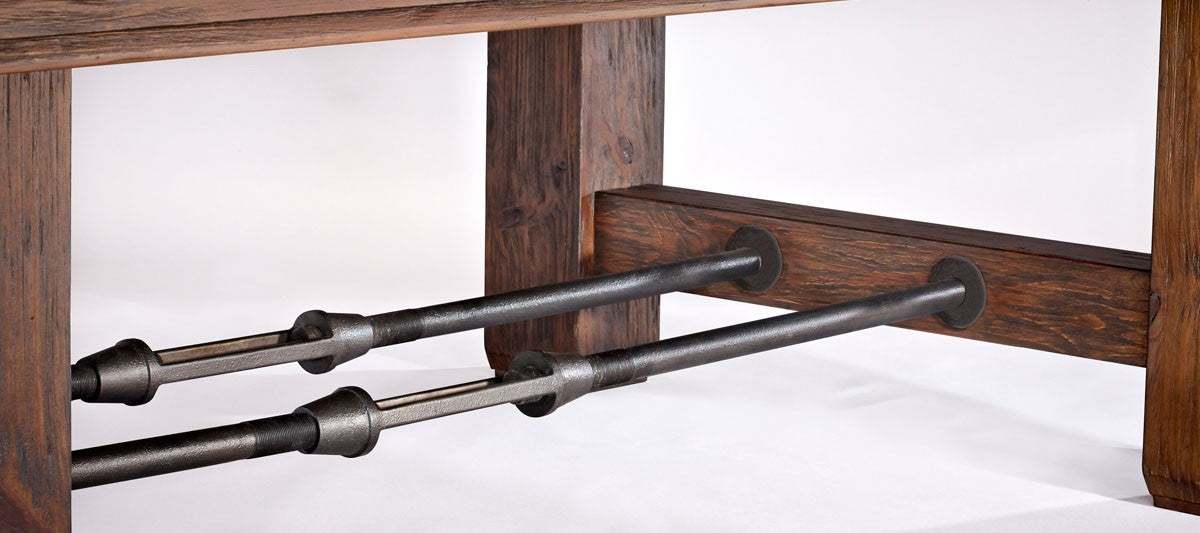 Close-up of metal rods joining the wooden legs of the Brunswick Billiards Canton 7' Pool Table.