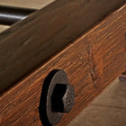 Close-up of Brunswick Billiards Canton 7' Pool Table in Black Forest with black metal bolts.