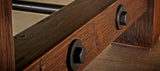 Close-up of Brunswick Billiards Canton 7' Pool Table in Black Forest with black metal bolts.