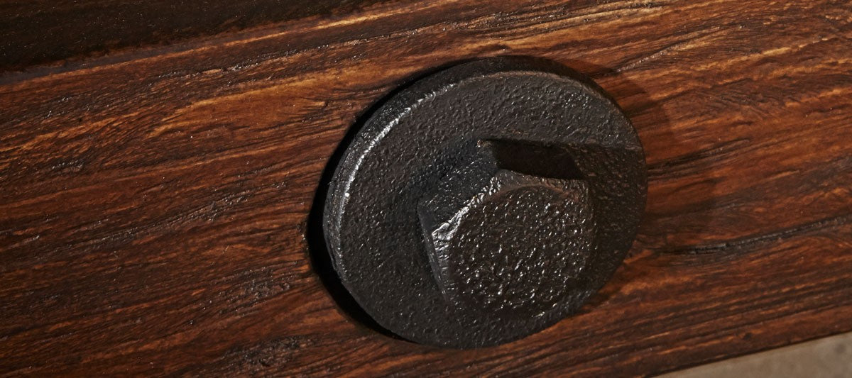 Close-up of a black metal bolt on the Brunswick Billiards Canton 7' Pool Table in Black Forest.