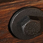 Close-up of a black metal bolt on the Brunswick Billiards Canton 7' Pool Table in Black Forest.
