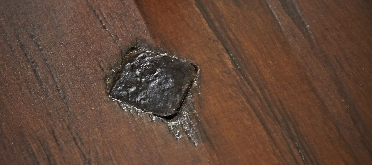 Close-up of a burnt spot on a Brunswick Billiards Canton 7' Pool Table in Black Forest.