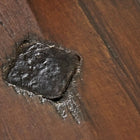 Close-up of a burnt spot on a Brunswick Billiards Canton 7' Pool Table in Black Forest.