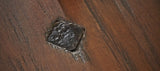 Close-up of a burnt spot on a Brunswick Billiards Canton 7' Pool Table in Black Forest.