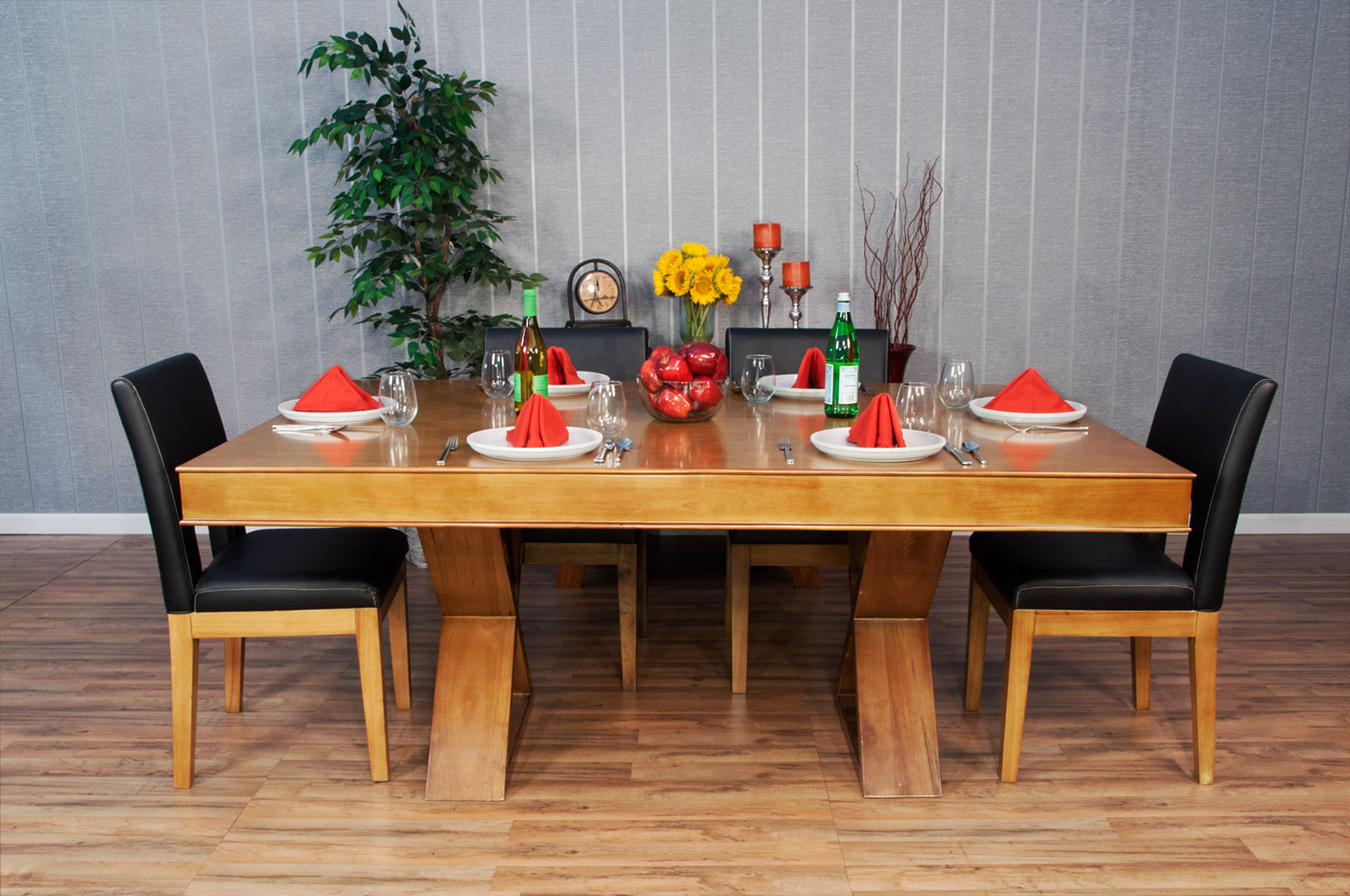A BBO The Helmsley Poker Table with Dining Top, set for four with red napkins, plates, glasses.