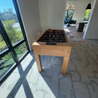 Venture Buckhead Foosball Table on a carpet in a room with window.