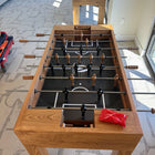 Venture Buckhead Foosball Table in a room with large windows.