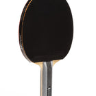 Table tennis paddle with black rubber and wooden handle on a white background