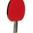 Red ping pong paddle with a black handle on a white background