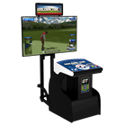 A Golden Tee golf arcade machine with a large front-facing monitor showing a golf game, a smaller overhead display, and a control console with a touch screen, photographed on a plain white background.