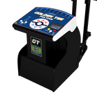 A black golf simulator with a blue and white digital display screen on top, featuring the text 'GOLDEN TEE PGA TOUR' and a 'GT' decal on the front, shown on a solid white background.