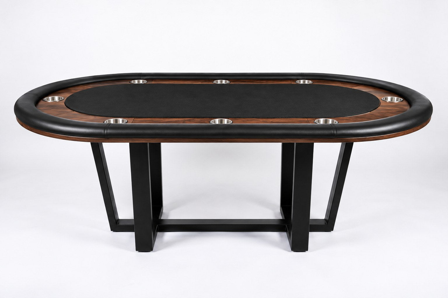 An oval poker table with a black felt playing surface, dark wood edges, and black metal legs, photographed on a clean white studio background.